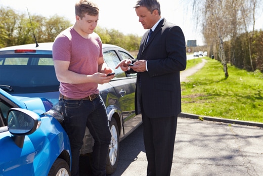 Insurance agent and customer discuss car policy